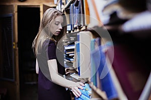 Lifestyle portrait of a lovely student girl in vintage library or bookstore