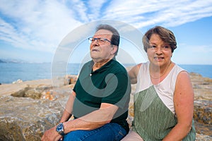 Lifestyle portrait of loving happy and sweet mature couple - senior retired husband and wife on 70s enjoying beach walk relaxed