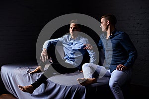 Lifestyle portrait of two handsome boys tween brothers in loft studio