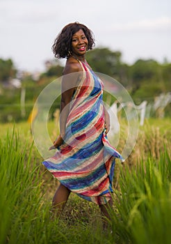 Lifestyle portrait of young attractive and happy black African American woman posing cheerful having fun outdoors at beautiful