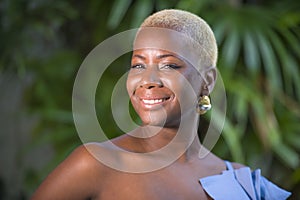 Lifestyle portrait of young attractive and joyful black african american woman smiling happy posing cheerful at home terrace with