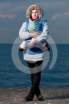 Lifestyle portrait of young mother