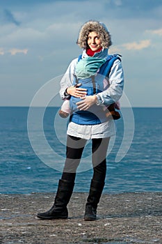 Lifestyle portrait of young mother