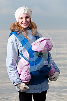 Lifestyle portrait of young mother