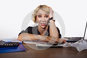 Lifestyle portrait of young stressed and messy business woman working at office laptop computer desk feeling tired and overwhelmed