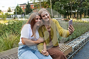 Lifestyle sunny image of two best friend taking selfie on camera, crazy emotions, happy vacations, shopping day.