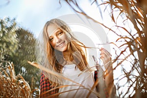 Lifestyle sunny outdoor portrait of young smiling teenage girl