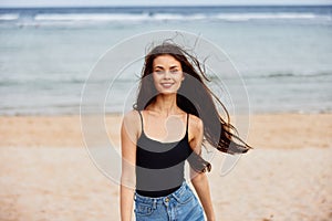 lifestyle woman running beach travel activity summer sunset smile young sea