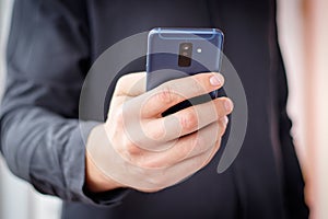 lifestyle young man using a mobile phone with texting message on