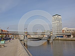 Liffey river, with railway bridge and apartmet tower, Dublin