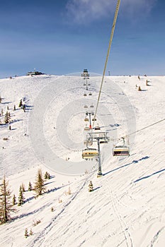 A lift is bringing skiers to top of the gerlitzen mountain in austria...IMAGE