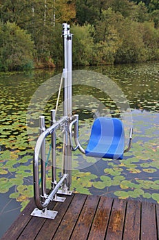 A lift chair as device for handicapped persons on the Ibm lake, in Upper Austri