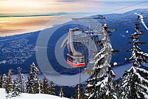 Lift gondola over Vancouver and Capilano lake from Grouse Grind