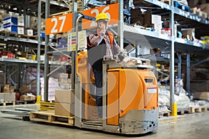 Lift operator preparing products for shipment