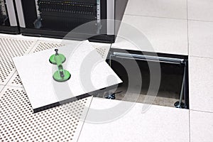 Lifted Datacenter Floor Tile With Vacuum Suction Cups In Datacenter