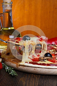 Lifted pizza slice photo