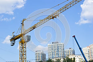 Lifting crane. Crane work on the construction site