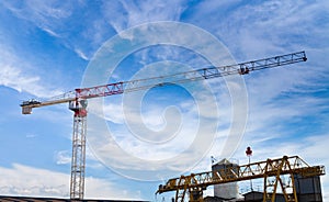 Lifting crane under blue sky