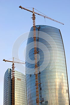 Lifting cranes on the construction of modern high-rise buildings. Baku