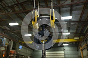 Lifting hook suspended by wires ropes.