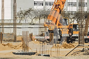 The lifting mechanism of industrial equipment of the crane machine on the construction site
