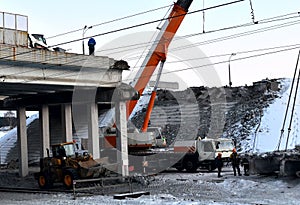 Lifting truck crane, dismantling a large reinforced concrete slab,