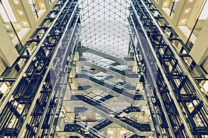 Lifts and escalators in a modern building, view of modern shopping mall