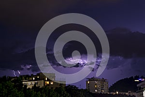 Lighning bolt over night sky in central Europe, Austria.