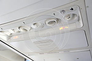 Light,air conditioning buttons control and belt sign in a modern plane.