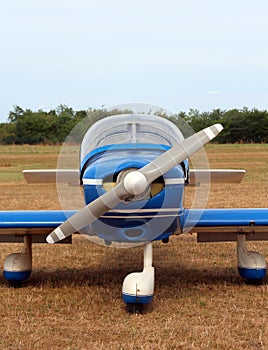 Light aircraft at the airport with a big propeller