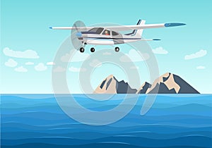 Light aircraft flies above sea.