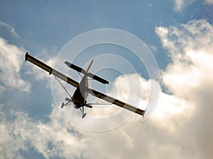 Light aircraft flying away to the sky.