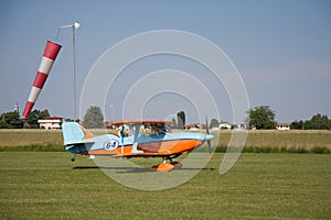 Light aircraft, modern biplane orange and blue