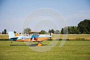 Light aircraft, modern biplane orange and blue