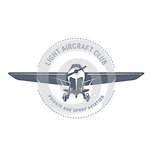 Light aviation emblem with biplane , vintage airplane icon,  propeller aircraft front view logo, vector