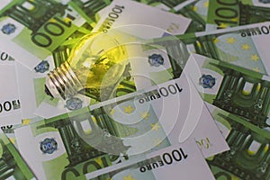 Light on the background of Euro money, expensive electricity