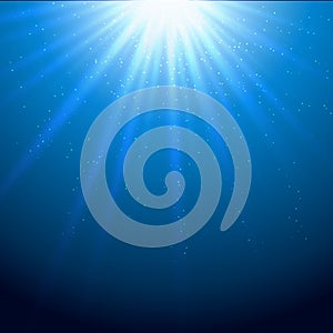 Light beams sparkling blue background