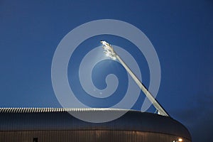 Light beams from stadium light in the ADO soccer stadium in The photo