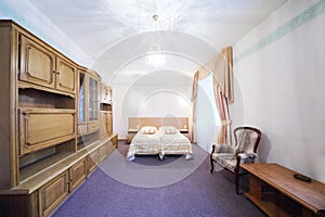 Light bedroom with a double bed and wall