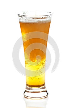 Light beer with the foam in a tall glass