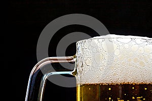 Light Beer in a glass pint mug served on a wooden