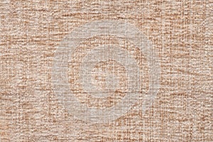 Light beige background of soft, fleecy cloth. Texture of textile closeup