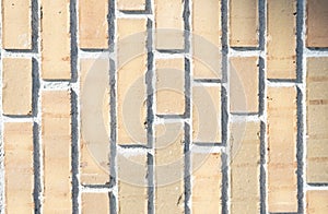 Light beige brick wall with vertical layers. Modern brick pattern.