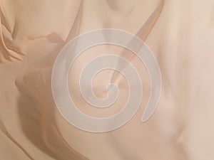 Light beige fabric in the wind background