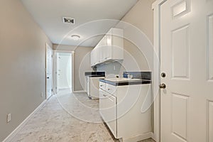 Light beige interior of tiled mudroom