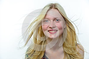 Light blonde girl with long hair in wind