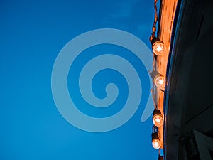 Light blubs on the roof edge.