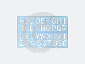 Light blue alphabet stencil lettering PVC plastic ruler template isolated on white background