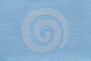 Light blue background from a textile material with wicker pattern, closeup.