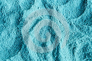 Light blue bentonite clay powder alginate, facial mask, eye shadow, body wrap texture close up, selective focus. Abstract